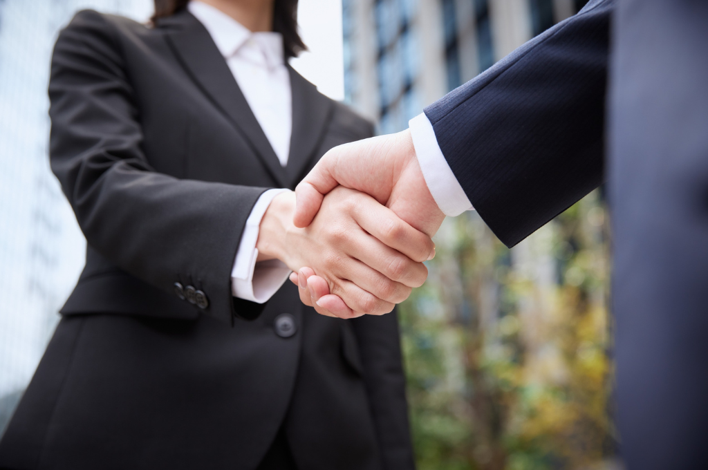 Japanese businessman signing a contract as company representative
