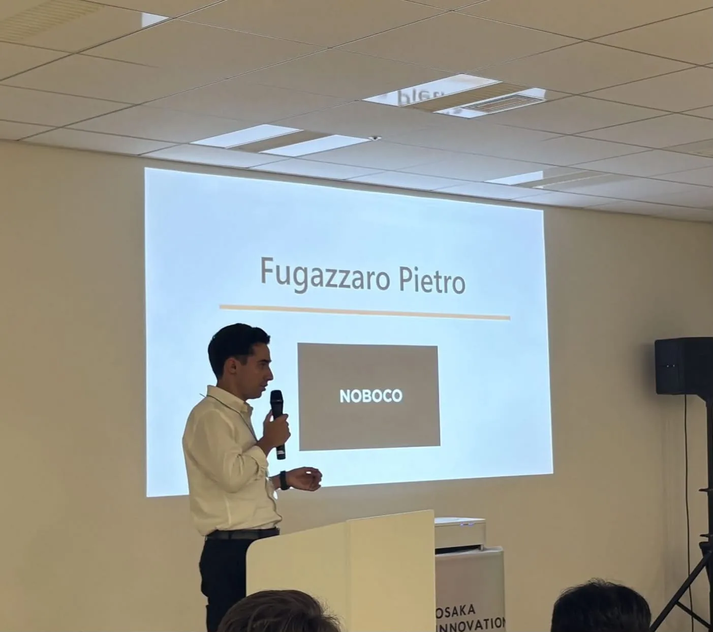 Pietro Fugazzaro presenting NOBOCO at an Osaka business event